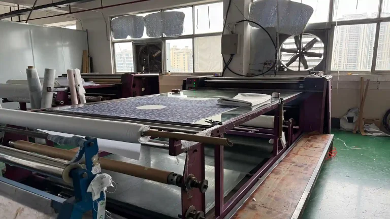 Industrial thermal sublimation transfer at 180-200°C, fusing graphics into fabric for gaming mouse pads and custom desk mats